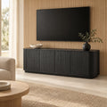 Meuble TV noir arrondi cannelé 163 cm, dans un salon